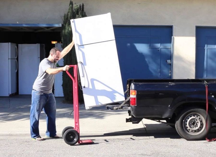 can you lay a refrigerator down to transport it