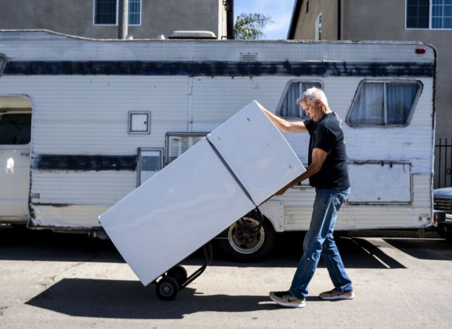 can you lay a refrigerator down to transport it