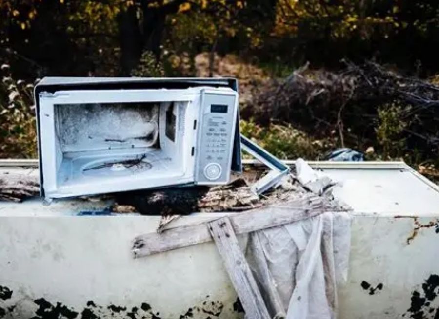 can you throw a microwave in the trash